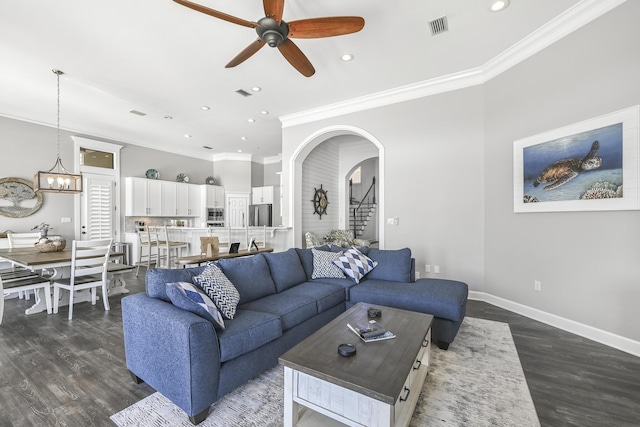 4720 Rendezvous Cv, Destin, FL 32541 - living area with a ceiling fan, dark wood-style flooring, recessed lighting, ornamental molding, and arched walkways
