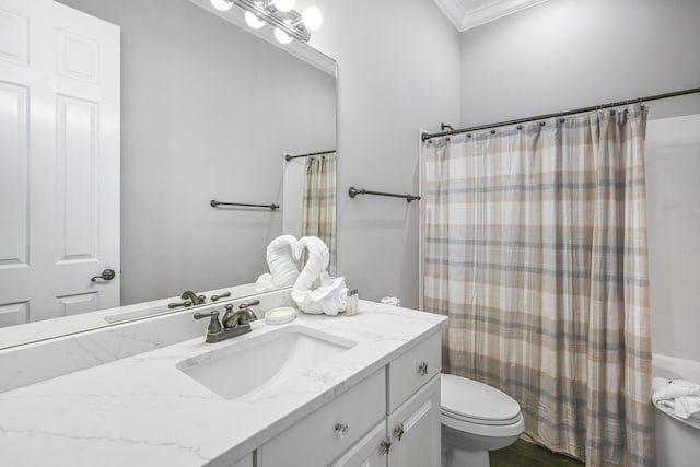 4720 Rendezvous Cv, Destin, FL 32541 - full bathroom featuring crown molding, toilet, vanity, curtained shower, and wood finished floors