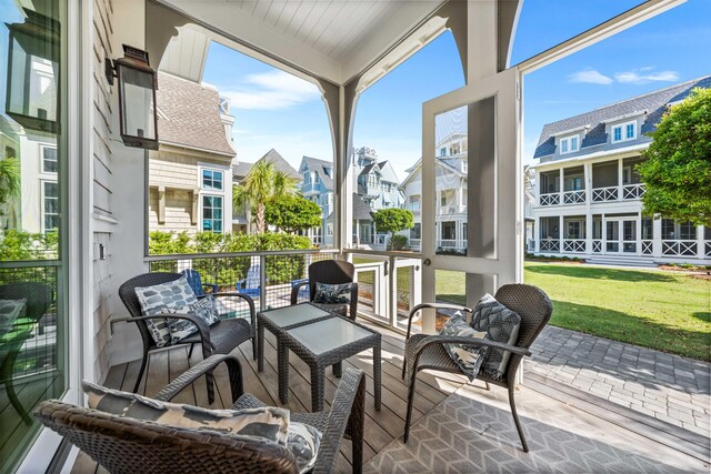 sunroom featuring a residential view and plenty of natural light