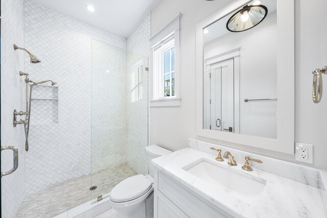 full bathroom with toilet, recessed lighting, a shower stall, and vanity