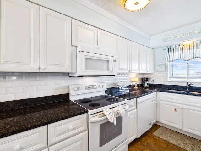 5801 Thomas Dr Unit 415, Panama City Beach, FL 32408 - kitchen featuring a sink, tasteful backsplash, white cabinetry, white appliances, and crown molding