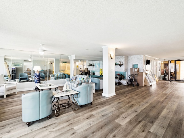 5801 Thomas Dr Unit 415, Panama City Beach, FL 32408 - living room featuring light wood-style flooring and a textured ceiling