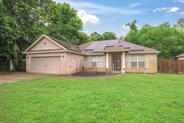 472 W College Blvd, Valparaiso, FL 32580 - ranch-style house featuring a garage, solar panels, brick siding, driveway, and roof with shingles