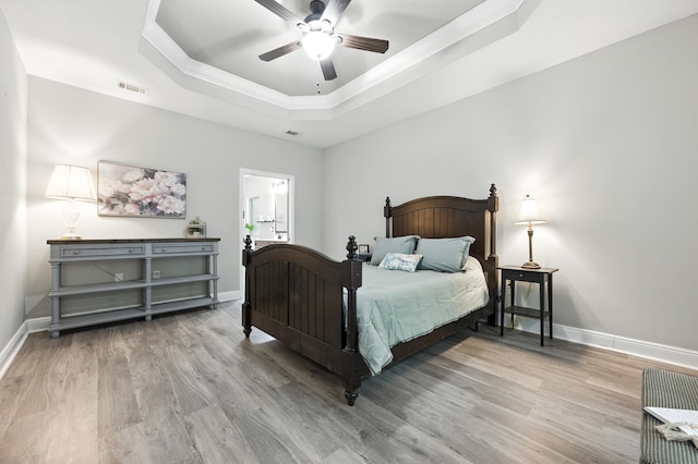 472 W College Blvd, Valparaiso, FL 32580 - bedroom with a raised ceiling, wood finished floors, crown molding, and ceiling fan