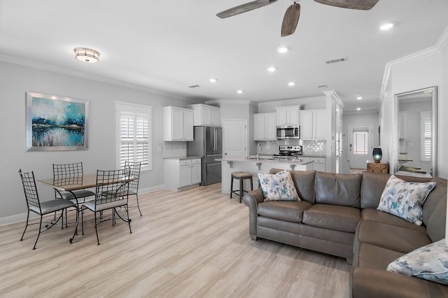 85 Stonegate Dr, Santa Rosa Beach, FL 32459 - living room featuring light wood-style flooring, visible vents, recessed lighting, ceiling fan, and ornamental molding