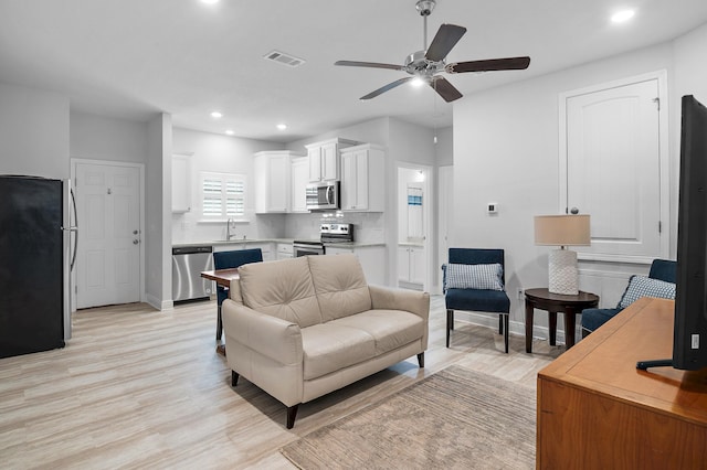 85 Stonegate Dr, Santa Rosa Beach, FL 32459 - living area with light wood finished floors, baseboards, visible vents, recessed lighting, and a ceiling fan