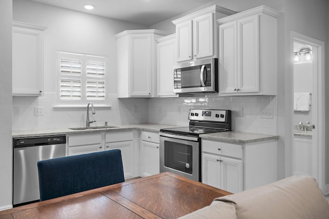 85 Stonegate Dr, Santa Rosa Beach, FL 32459 - kitchen featuring a sink, white cabinetry, and appliances with stainless steel finishes