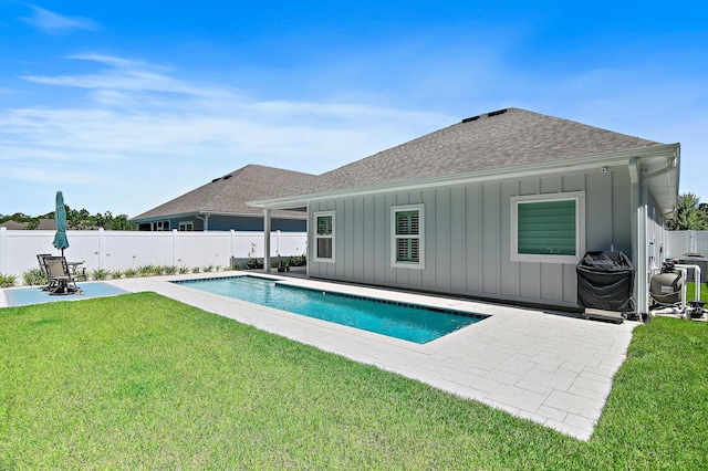 85 Stonegate Dr, Santa Rosa Beach, FL 32459 - view of swimming pool featuring a lawn, a fenced backyard, a fenced in pool, and a patio