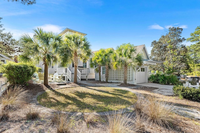 265 Salt Box Ln, Watersound, FL 32461 - view of front of property featuring an attached garage, covered porch, and concrete driveway