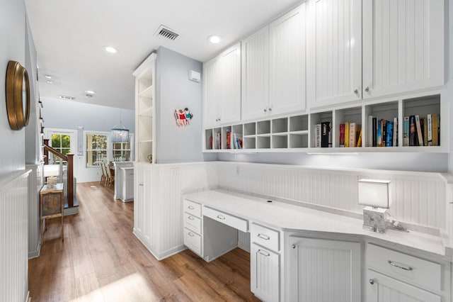 265 Salt Box Ln, Watersound, FL 32461 - office featuring built in study area, light wood-style floors, wainscoting, and visible vents