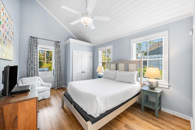 265 Salt Box Ln, Watersound, FL 32461 - bedroom with a closet, baseboards, wooden ceiling, light wood-style flooring, and vaulted ceiling