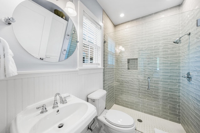 265 Salt Box Ln, Watersound, FL 32461 - full bath featuring a sink, a wainscoted wall, a stall shower, and toilet