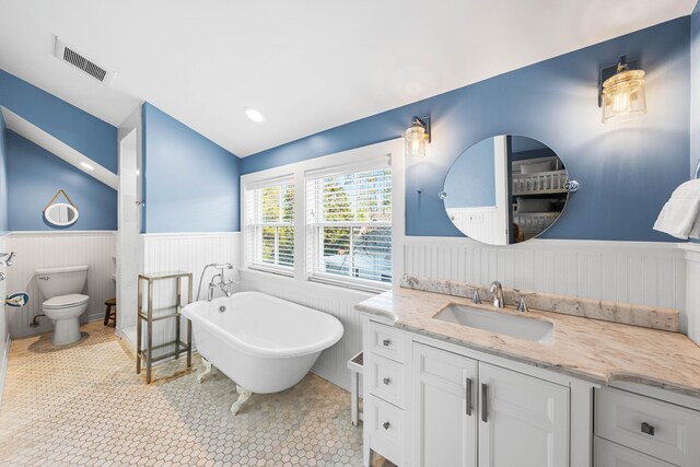 265 Salt Box Ln, Watersound, FL 32461 - full bath featuring a freestanding tub, visible vents, wainscoting, and vanity