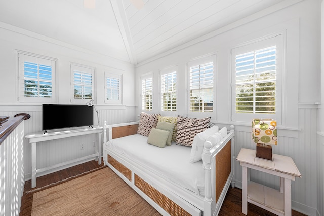265 Salt Box Ln, Watersound, FL 32461 - bedroom featuring a decorative wall, lofted ceiling, and a wainscoted wall
