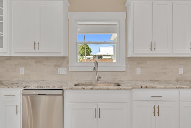 4003 Tarpon St, Panama City Beach, FL 32408 - kitchen featuring tasteful backsplash, stainless steel dishwasher, white cabinets, and a sink