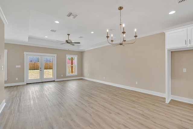 4003 Tarpon St, Panama City Beach, FL 32408 - unfurnished living room featuring visible vents, ceiling fan with notable chandelier, light wood-style floors, and a tray ceiling
