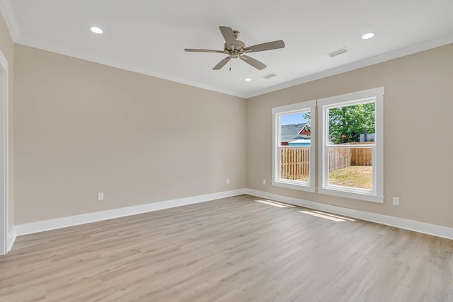 4003 Tarpon St, Panama City Beach, FL 32408 - empty room with crown molding, visible vents, and light wood-type flooring