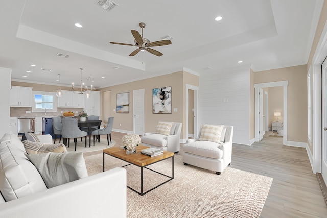 4003 Tarpon St, Panama City Beach, FL 32408 - living room featuring visible vents, light wood-style floors, and a tray ceiling