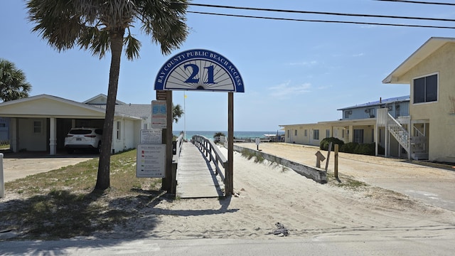 4003 Tarpon St, Panama City Beach, FL 32408 - view of community with concrete driveway, a water view, and an attached carport