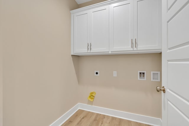 4003 Tarpon St, Panama City Beach, FL 32408 - laundry room featuring hookup for an electric dryer, cabinet space, hookup for a washing machine, light wood-style flooring, and baseboards