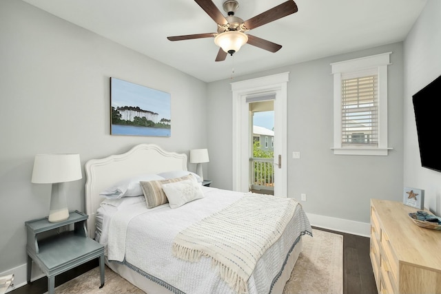 bedroom with baseboards, a ceiling fan, and dark wood-style flooring