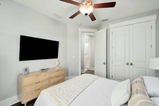 bedroom with visible vents, baseboards, ceiling fan, and a closet