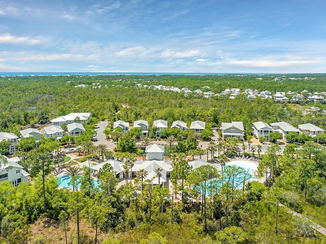 bird's eye view featuring a residential view and a view of trees