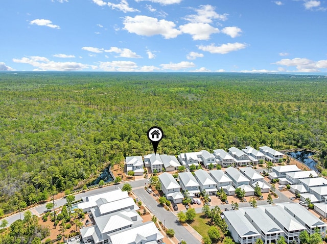 birds eye view of property featuring a view of trees and a residential view