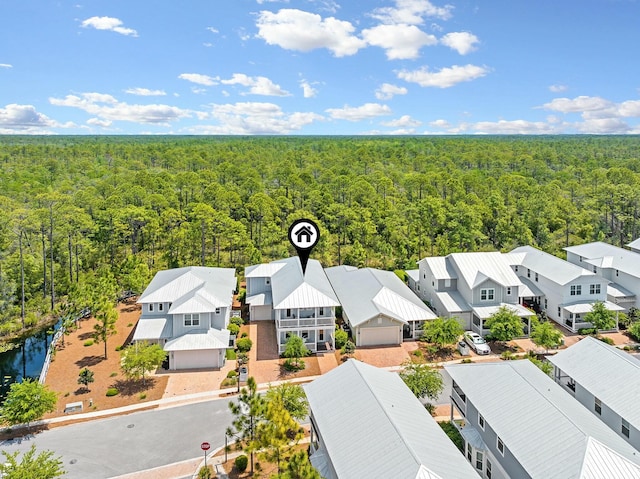 birds eye view of property featuring a residential view and a view of trees