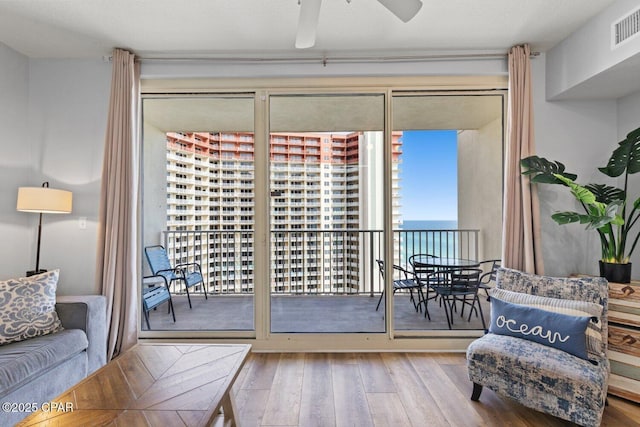 9900 S Thomas Dr Unit 1408, Panama City Beach, FL 32408 - sitting room featuring hardwood / wood-style flooring, visible vents, and ceiling fan