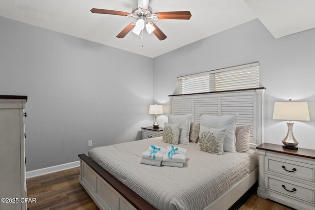 9900 S Thomas Dr Unit 1408, Panama City Beach, FL 32408 - bedroom featuring ceiling fan, baseboards, and dark wood-style flooring