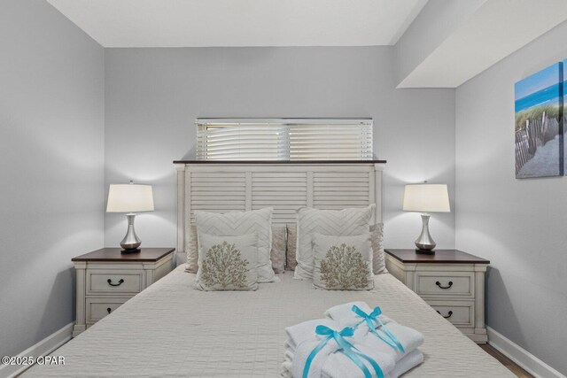 9900 S Thomas Dr Unit 1408, Panama City Beach, FL 32408 - bedroom featuring baseboards