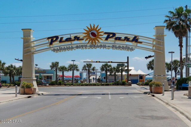 9900 S Thomas Dr Unit 1408, Panama City Beach, FL 32408 - view of road with traffic lights, sidewalks, curbs, and street lights