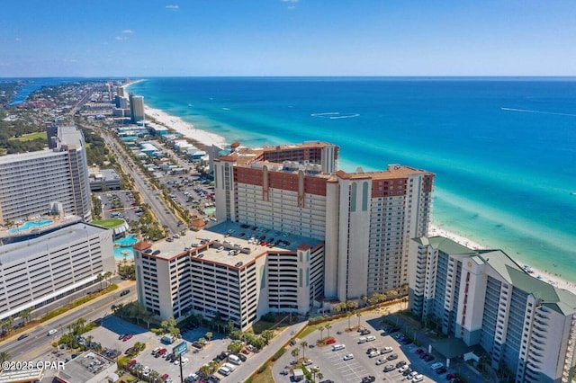 aerial view with a water view, a view of city, and a view of the beach