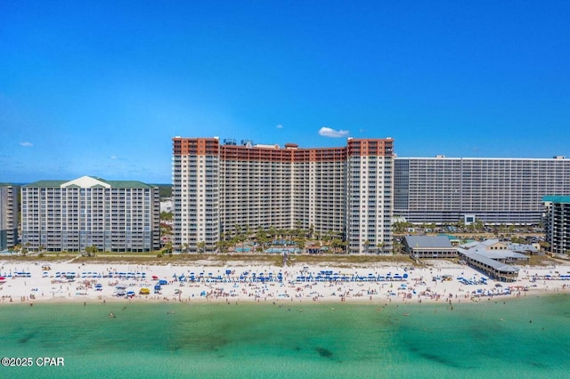 bird's eye view with a water view and a view of the beach