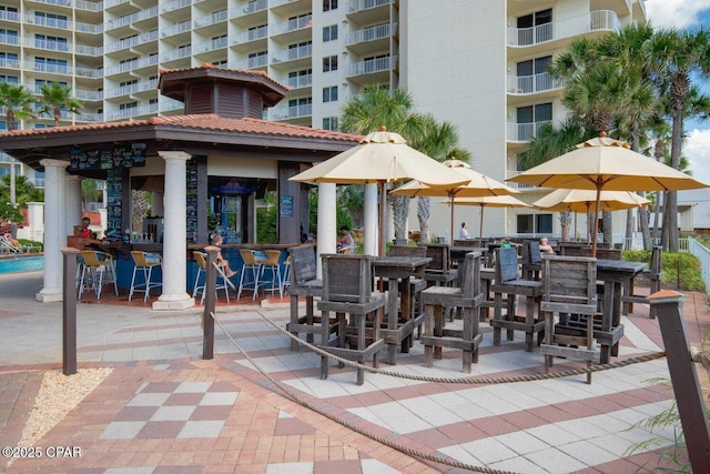 view of patio with a gazebo and outdoor dry bar