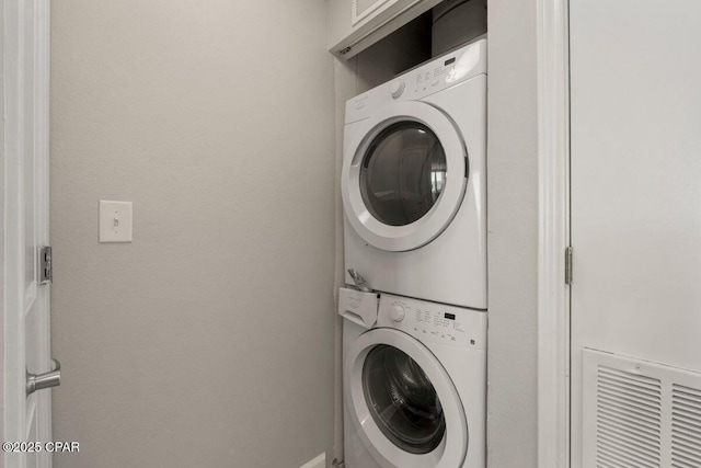 9900 S Thomas Dr Unit 1410, Panama City Beach, FL 32408 - laundry room with laundry area and stacked washer / dryer