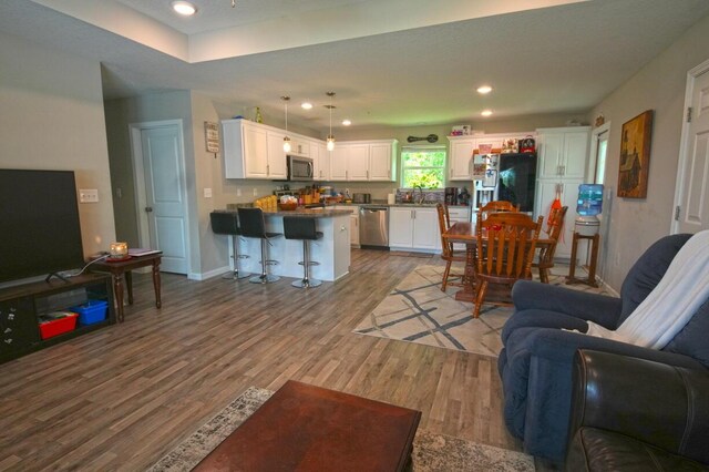 5594 Riviera Dr, Milton, FL 32583 - living area with baseboards, recessed lighting, and wood finished floors
