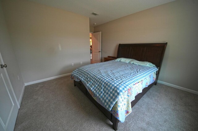 5594 Riviera Dr, Milton, FL 32583 - bedroom with carpet floors, baseboards, and visible vents