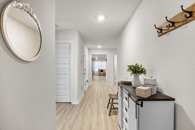 810 Otto Loop, Crestview, FL 32539 - hallway featuring baseboards, light wood finished floors, and recessed lighting