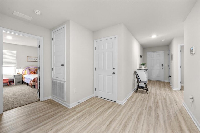 810 Otto Loop, Crestview, FL 32539 - hallway featuring light wood finished floors, baseboards, visible vents, and recessed lighting