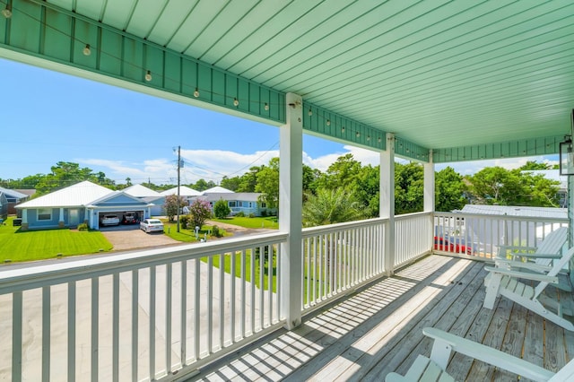 wooden terrace with a residential view