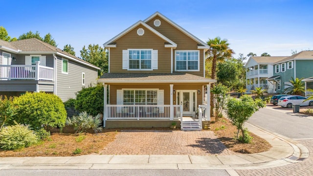 traditional home featuring covered porch