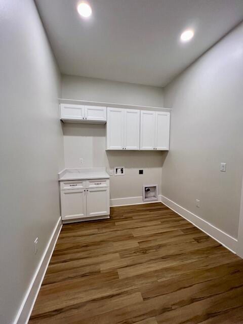 149 Leap Year Ln, Freeport, FL 32439 - laundry area featuring baseboards, hookup for a washing machine, cabinet space, and electric dryer hookup