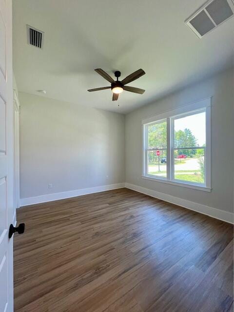 149 Leap Year Ln, Freeport, FL 32439 - spare room featuring baseboards, visible vents, and dark wood finished floors