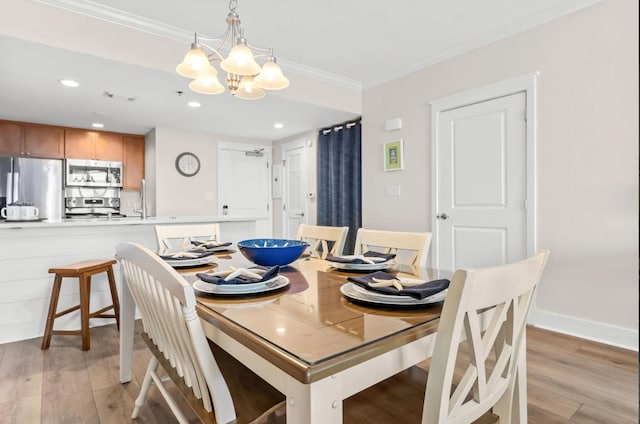 1110 Santa Rosa Blvd Unit A616, Fort Walton Beach, FL 32548 - dining area featuring recessed lighting, light wood-style floors, a chandelier, and crown molding
