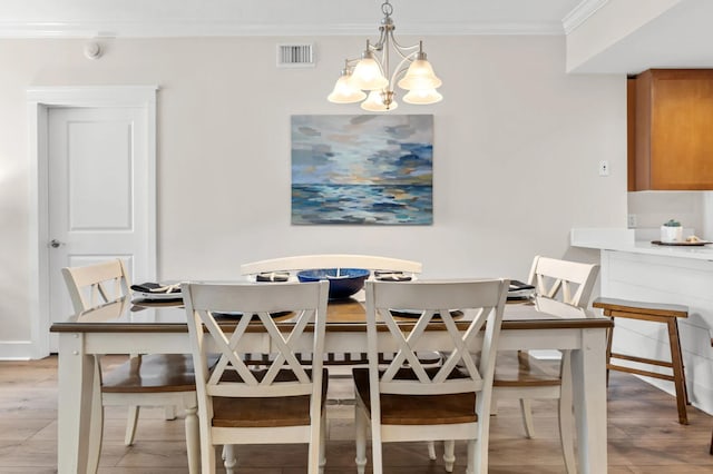 1110 Santa Rosa Blvd Unit A616, Fort Walton Beach, FL 32548 - dining room featuring visible vents, an inviting chandelier, light wood-style floors, and ornamental molding