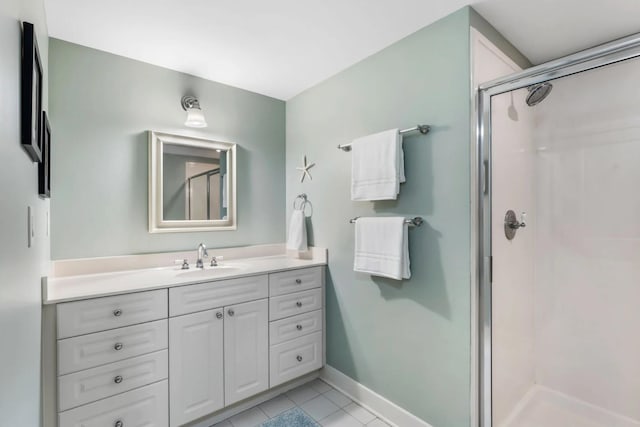 1110 Santa Rosa Blvd Unit A616, Fort Walton Beach, FL 32548 - full bathroom with tile patterned floors, baseboards, vanity, and a stall shower