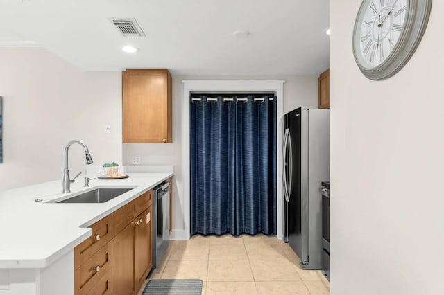 1110 Santa Rosa Blvd Unit A616, Fort Walton Beach, FL 32548 - kitchen with a sink, visible vents, appliances with stainless steel finishes, light countertops, and light tile patterned floors