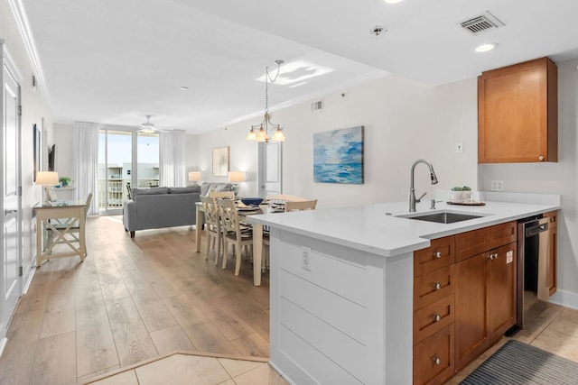 1110 Santa Rosa Blvd Unit A616, Fort Walton Beach, FL 32548 - kitchen with a sink, visible vents, dishwasher, brown cabinets, and light countertops